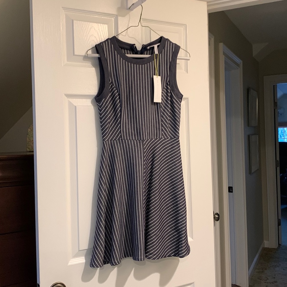 Rayon/poly swing dress in white/navy.Slightly above knee.